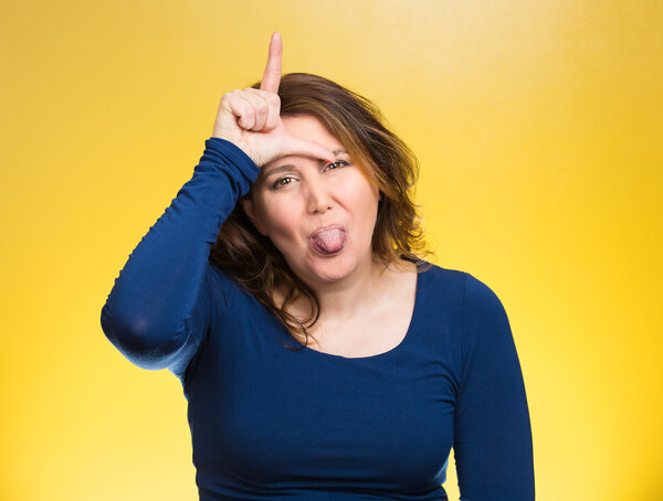 Mad pissed off woman, showing loser sign
