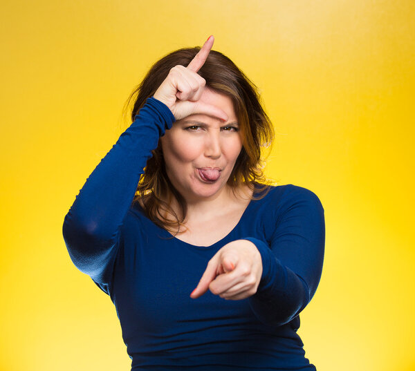 Mad pissed off woman, showing loser sign