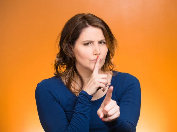 Woman placing finger, hand on lips, shhh gesture, be quiet — Stock Photo, Image