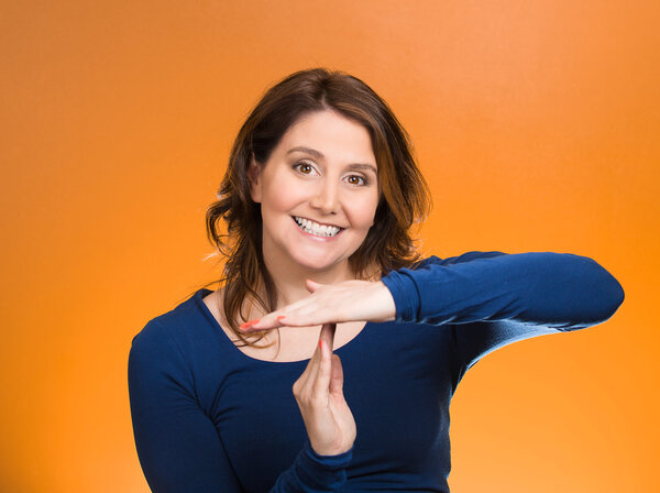 Woman showing time out gesture with hands