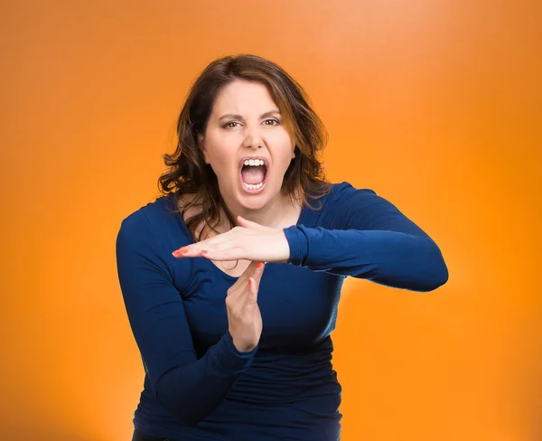 Screaming woman, showing time out gesture with hands