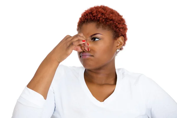 Woman, disgust on face, pinches nose, something stinks — Stock Photo, Image