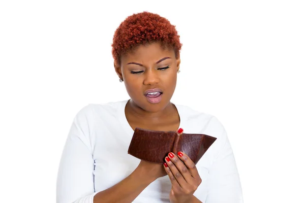 Unhappy young woman showing empty wallet — Stock Photo, Image