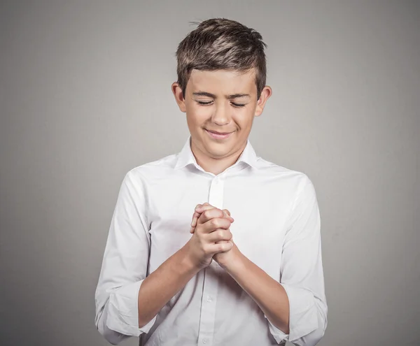 Man, teenager praying, arms clasped, eyes closed — Stock Photo, Image