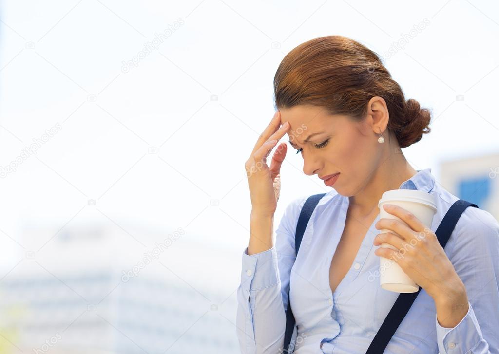 Woman stressed bothered by mistake having bad headache 