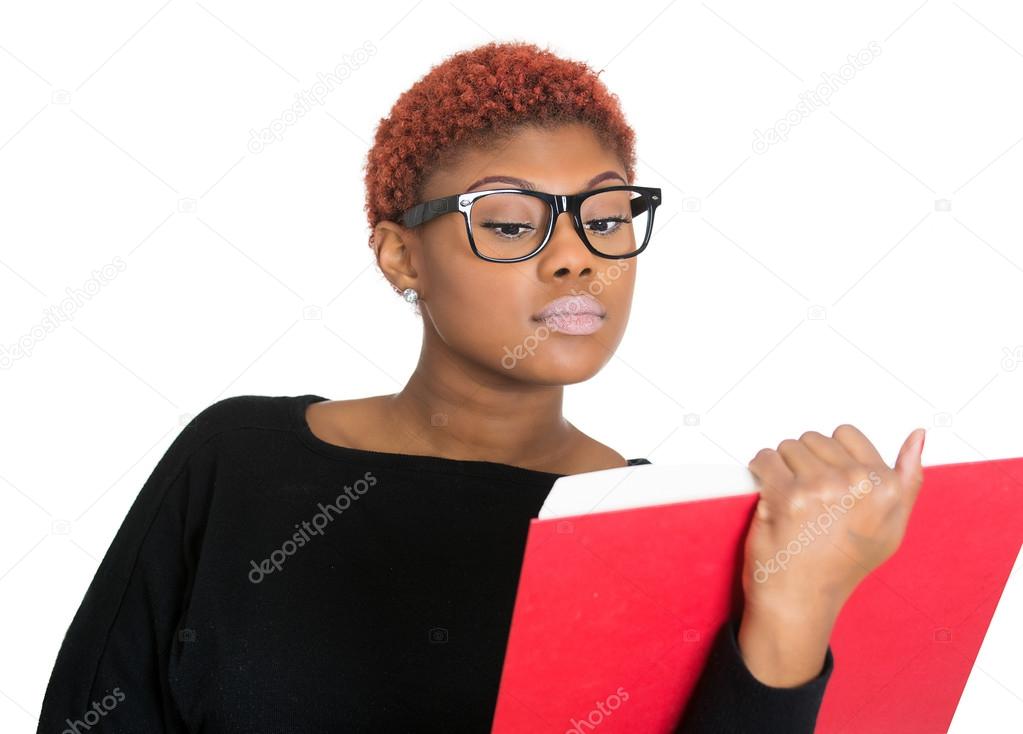 Young nerdy woman reading book