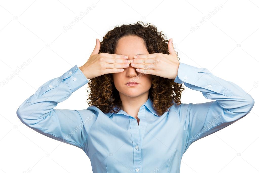 Woman covering eyes with hands can't look, hiding, avoiding situation