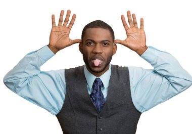 Man, sticking out tongue, thumbs hands on temple, mocking someone  clipart