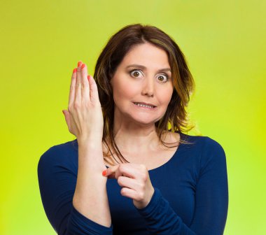 Woman pinching her arm skin, giving reality check gesture clipart