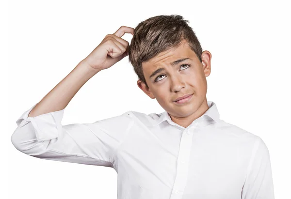 Young man scratching head, thinking daydreaming — Stock Photo, Image