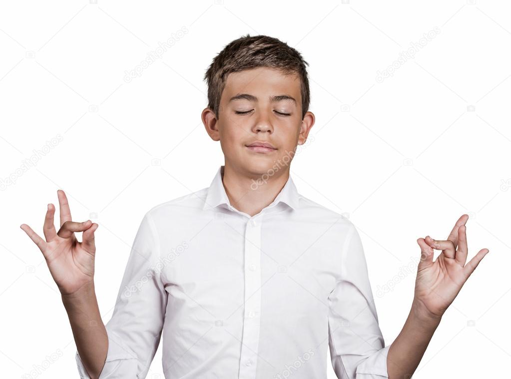 Handsome man in meditation pose, relaxing in zen mode