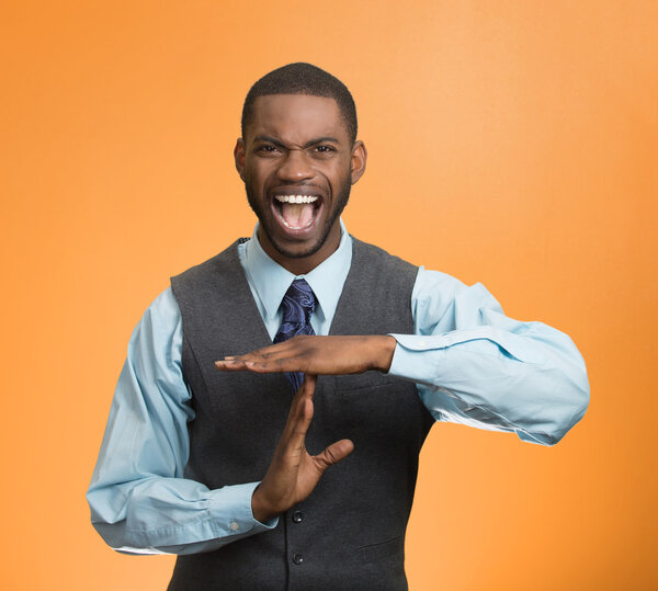 Angry business man showing time out gesture with hands