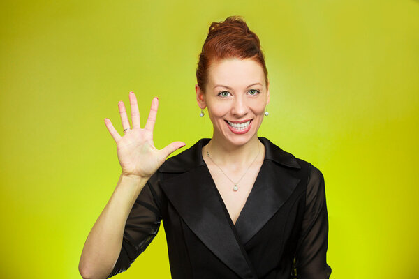 Young woman making five times sign gesture with hand fingers