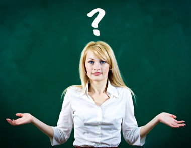 Confused, puzzled young woman shrugs shoulders clipart