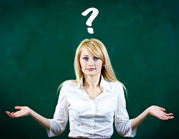 Confused, puzzled young woman shrugs shoulders — Stock Photo, Image