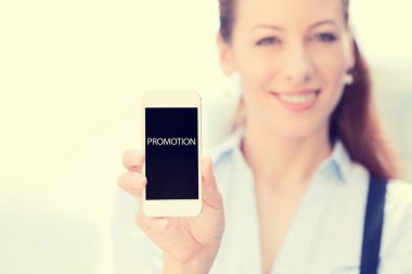 Businesswoman showing mobile smart phone with promotion sign on screen clipart