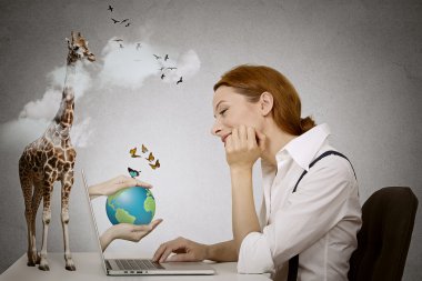Dreaming woman sitting in front of computer, hands with earth coming from laptop screen clipart