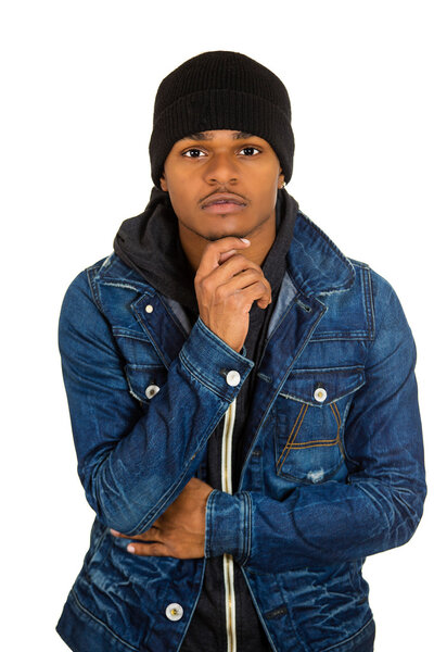 Handsome young man, posing fashion model, dressed in jeans