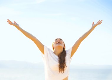 Free Happy girl on beach enjoying nature clipart