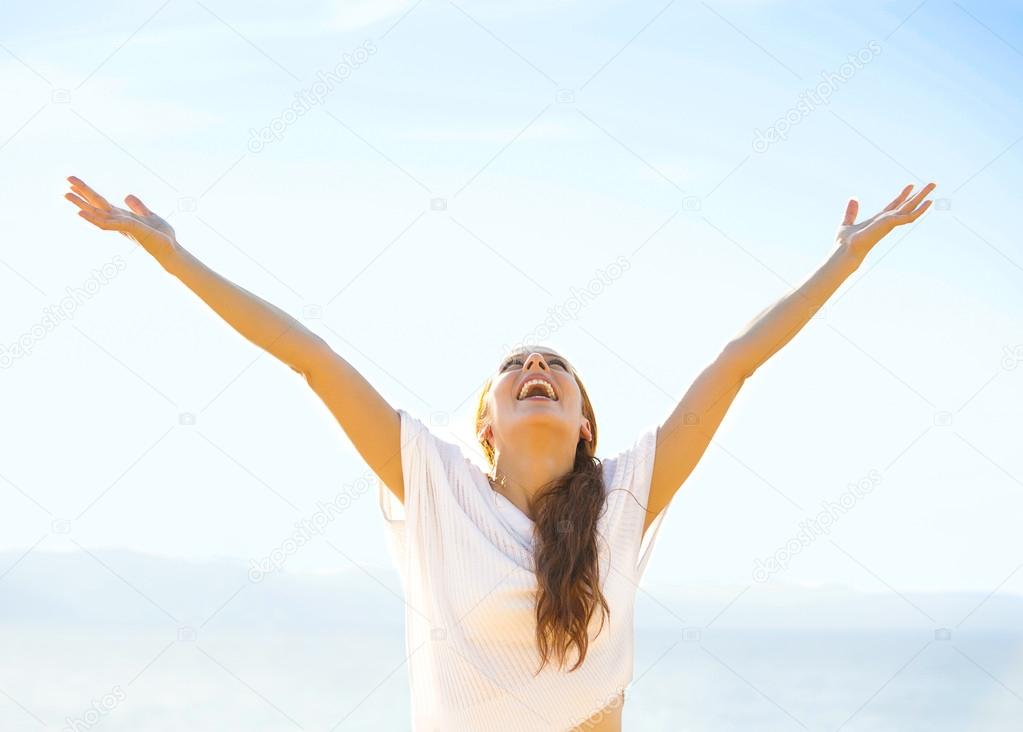 Free Happy girl on beach enjoying nature