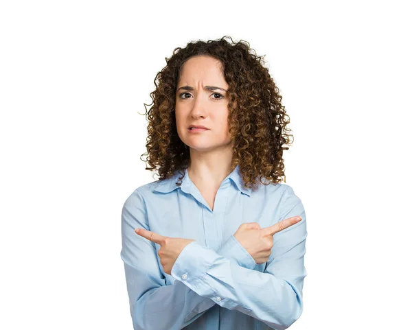 Confused woman pointing in two different directions — Stock Photo, Image