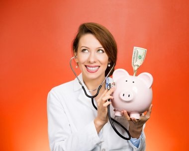 doctor listening with stethoscope to piggy bank clipart