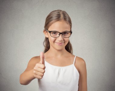 Happy teenager girl showing thumbs up clipart