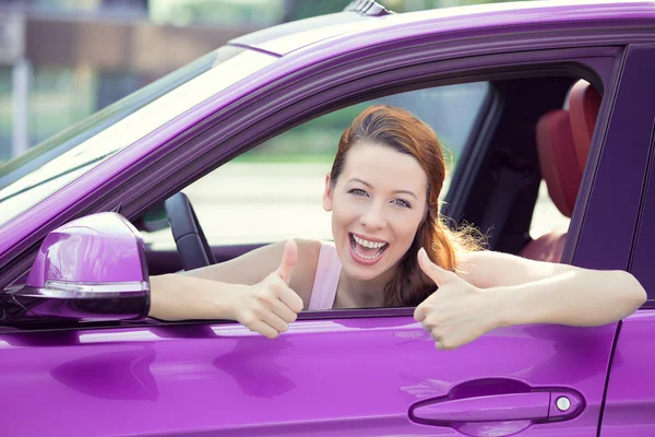 Woman driver happy smiling showing thumbs up