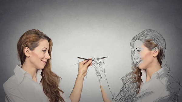 Woman drawing a picture, sketch of herself — Stock Photo, Image