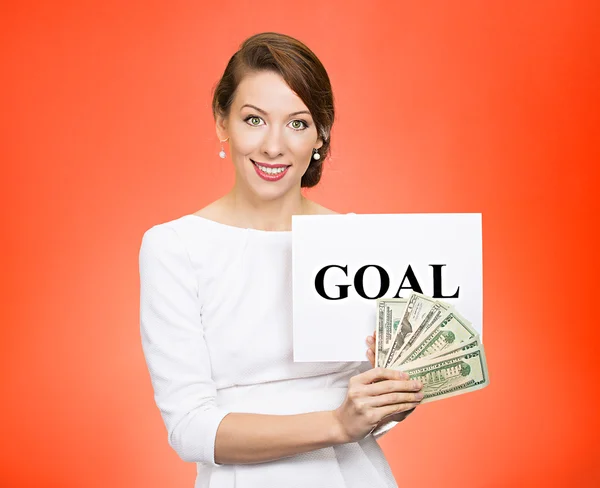 Businesswoman holding goal sign and money — Stock Photo, Image