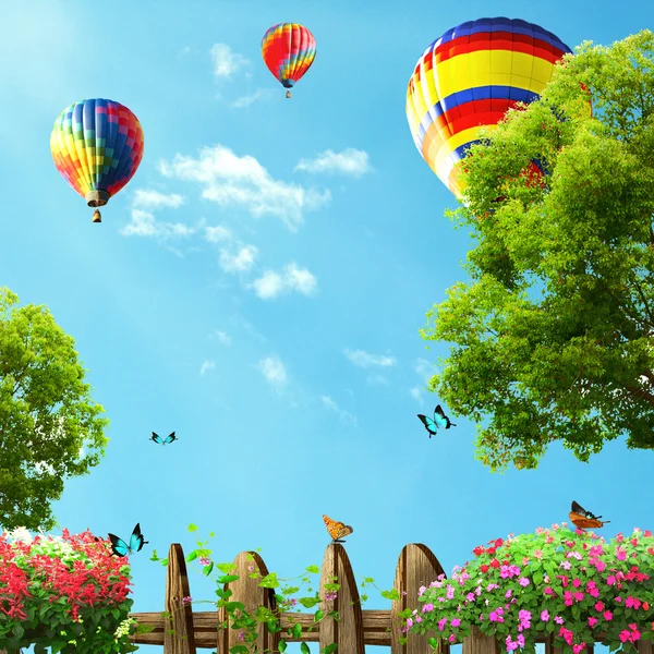 Hot air balloons high in the blue sky, view from house garden — Stock Photo, Image