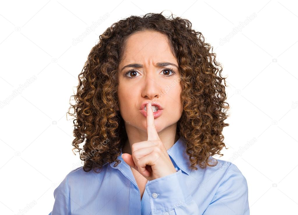 Woman placing finger hand on lips, shhh gesture, be quiet