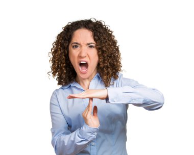 Serious woman showing time out gesture with hands clipart