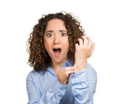 Surprised woman pinching her arm skin, giving reality check gesture clipart