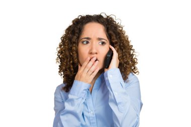 Worried brunette woman talking on phone clipart