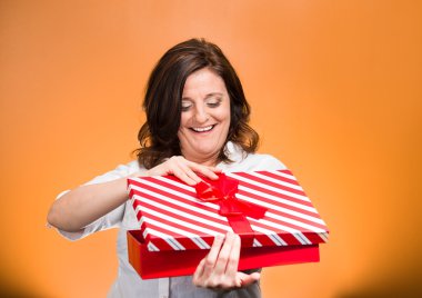 woman about to open, unwrap red birthday gift box