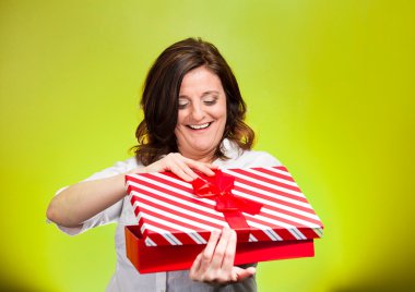 woman about to open, unwrap red birthday gift box