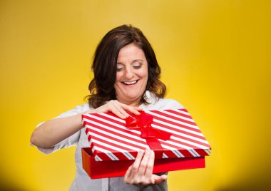 woman about to open, unwrap red birthday gift box