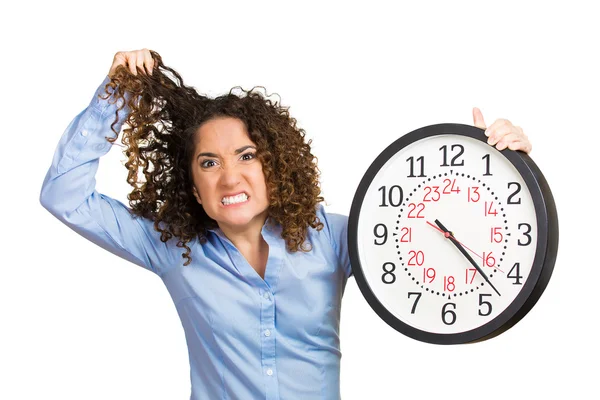 Woman, worker, holding clock looking anxiously — Stock Photo, Image