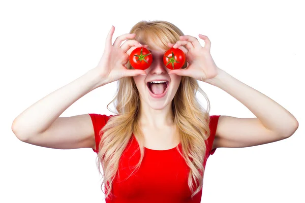 Woman holding, showing tomatoes over her eyes — Stock Photo, Image