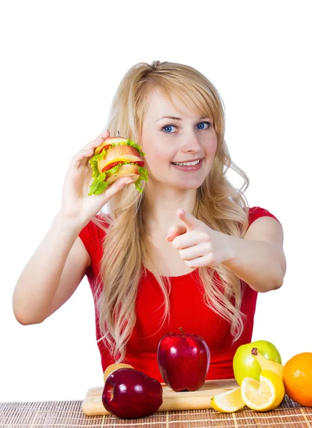 Smiling fit female holding, eating vitamin fruit sandwich — Stock Photo, Image