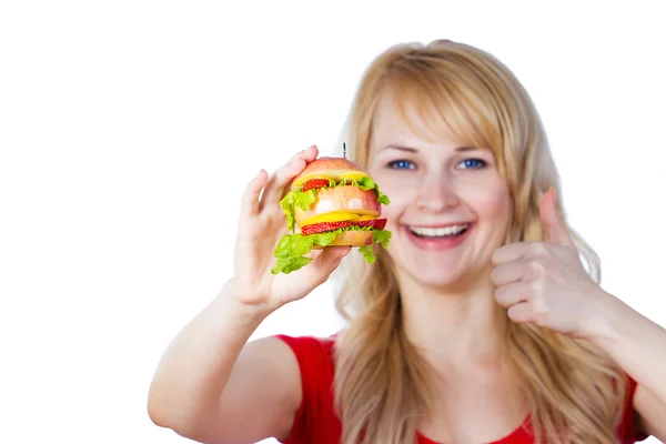 Young female holding vitamin sandwich made of apples and orange fruits — Stock fotografie