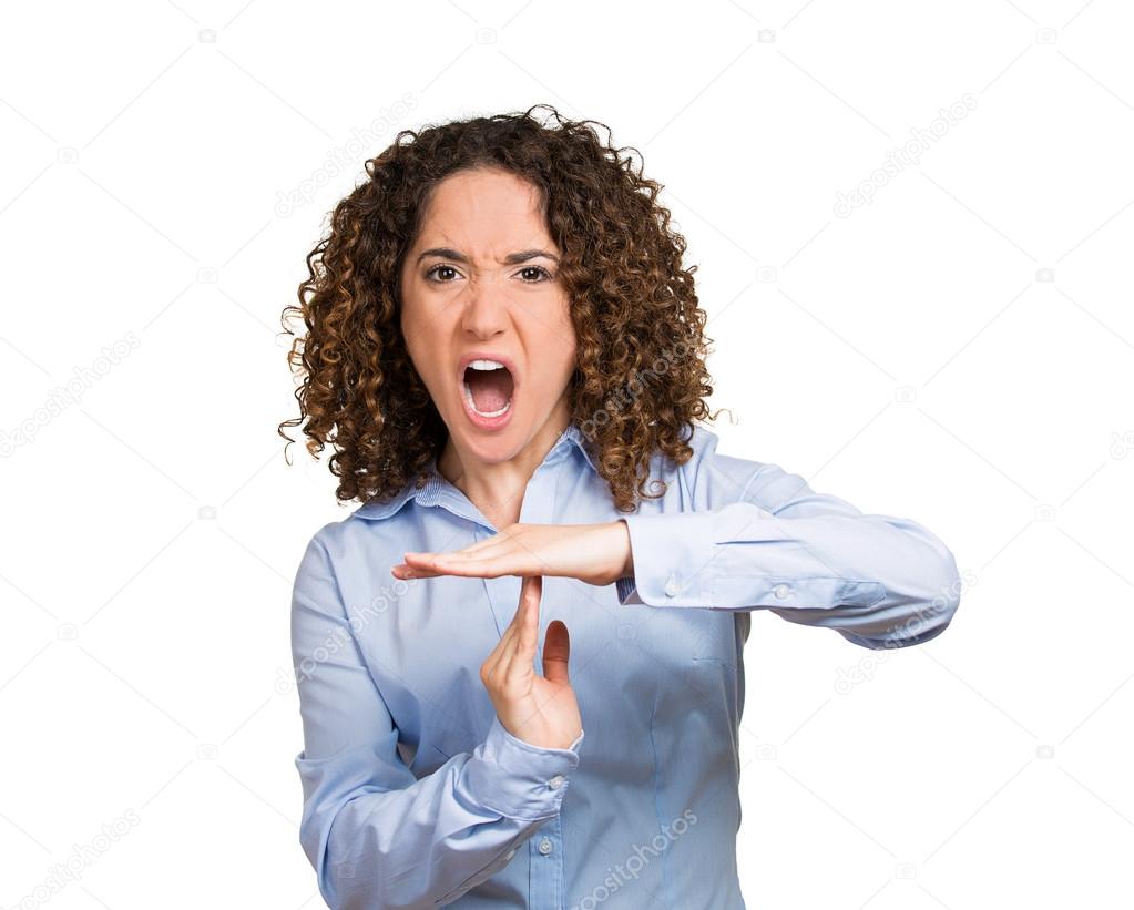 Serious woman showing time out gesture with hands