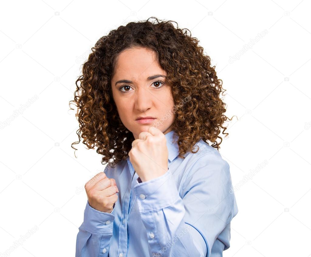 Angry, upset, hostile woman with fists in air,