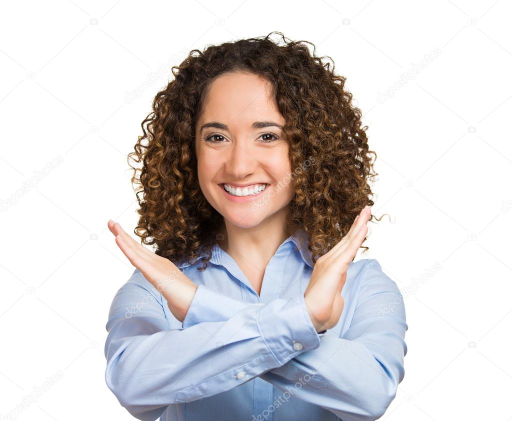 Smiling young woman making showing stop gesture