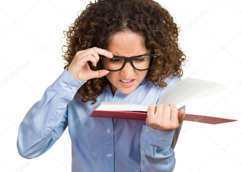 Young woman with eye glasses trying read book, having difficulties seeing text