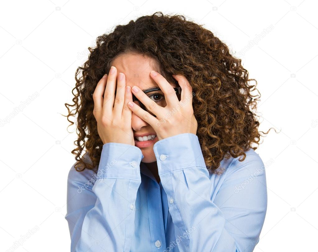Woman shy, flirting, hands covering entire face