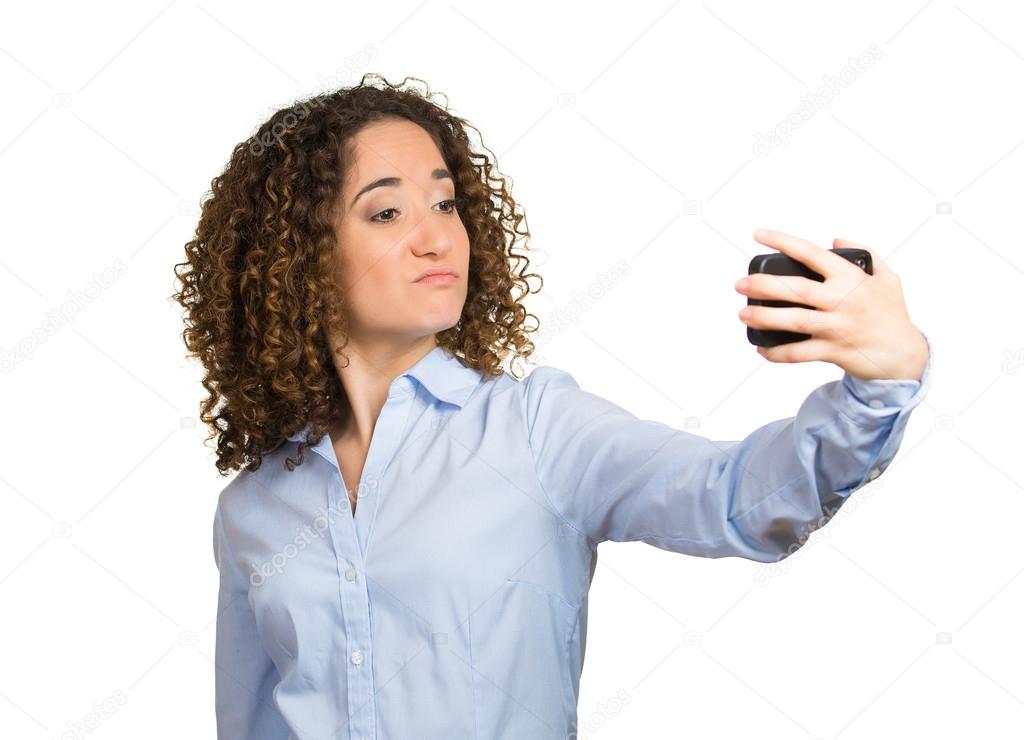 Woman, lady, checking, looking admiring her face, hair in mirror