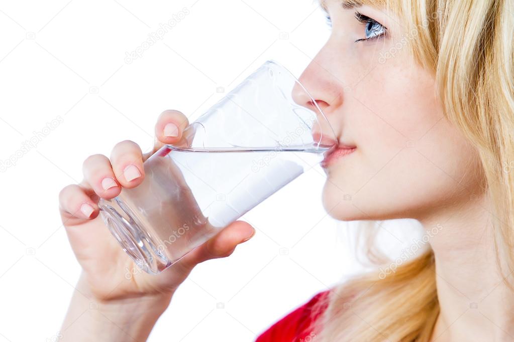 Headshot young beautiful, blonde woman drinking water
