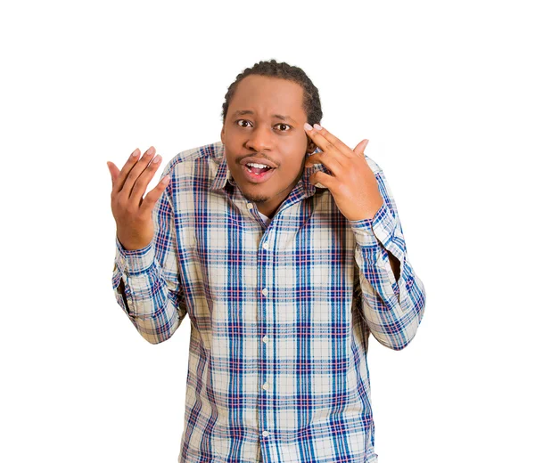 Rude, difficult, angry young man gesturing with fingers are you crazy? — Stock Photo, Image